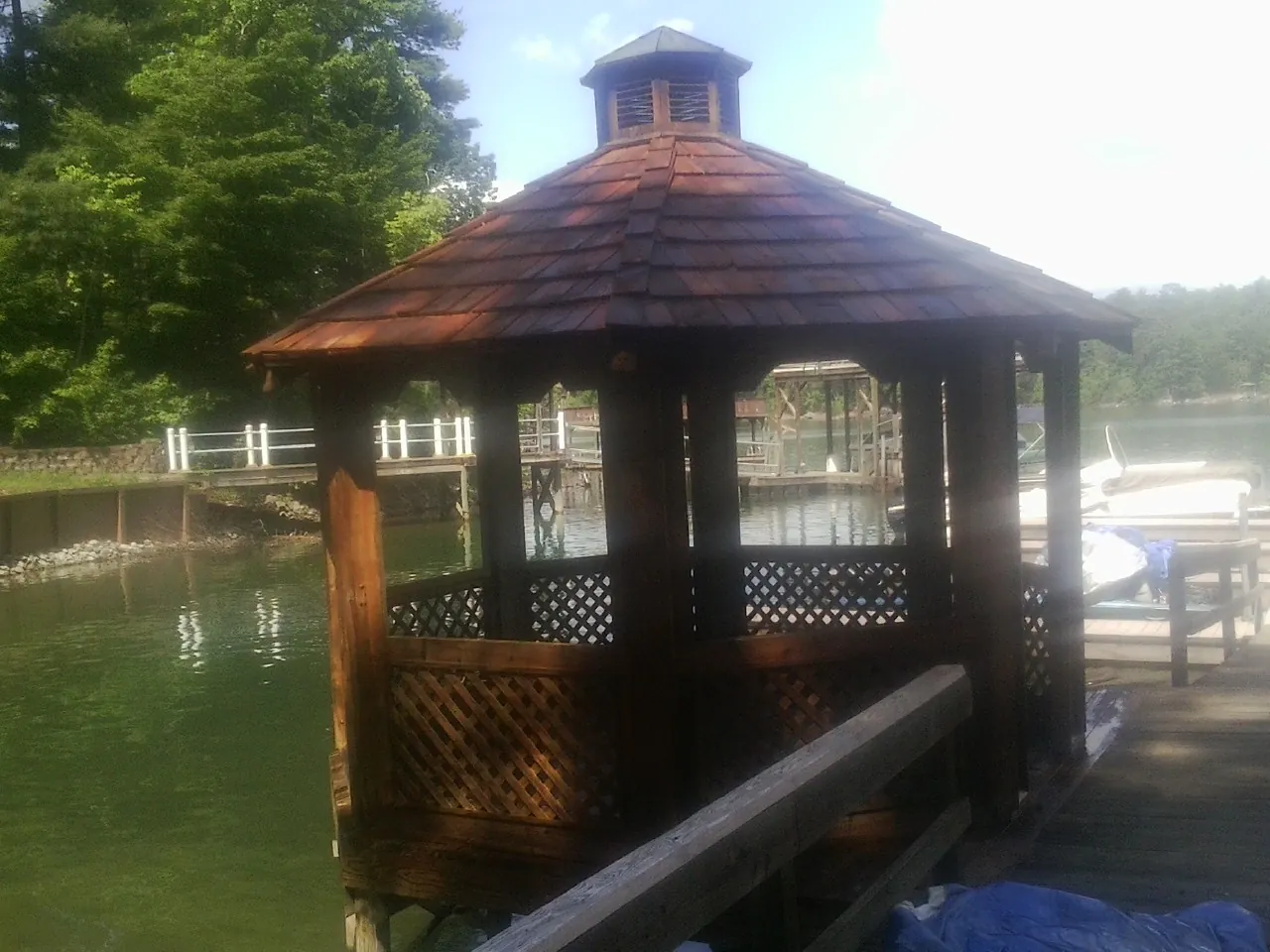 Cedar shake gazebo roof rebuilt on a lake dock in Duffield